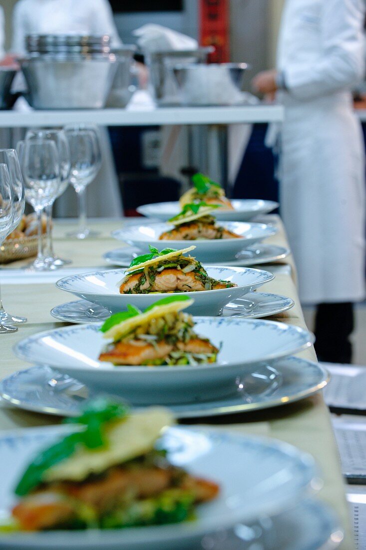 Salmon dishes in a commercial kitchen