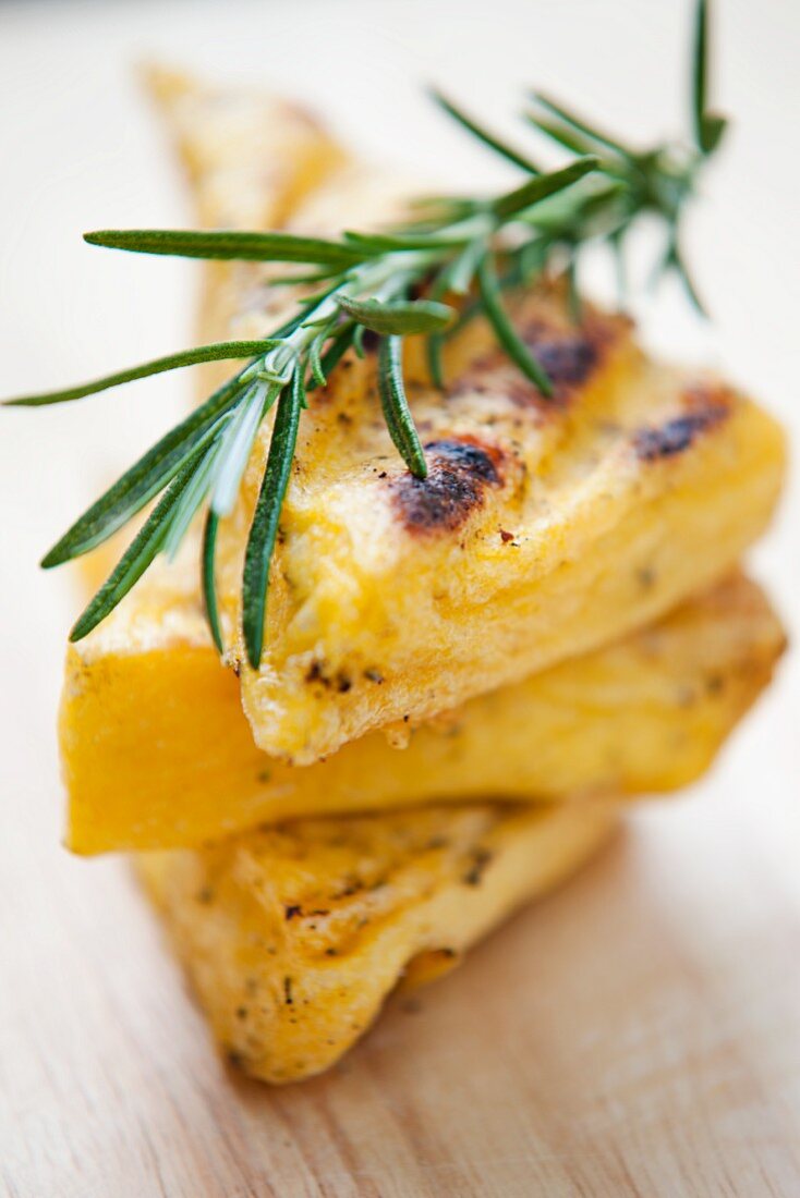 Grilled polenta slices with rosemary