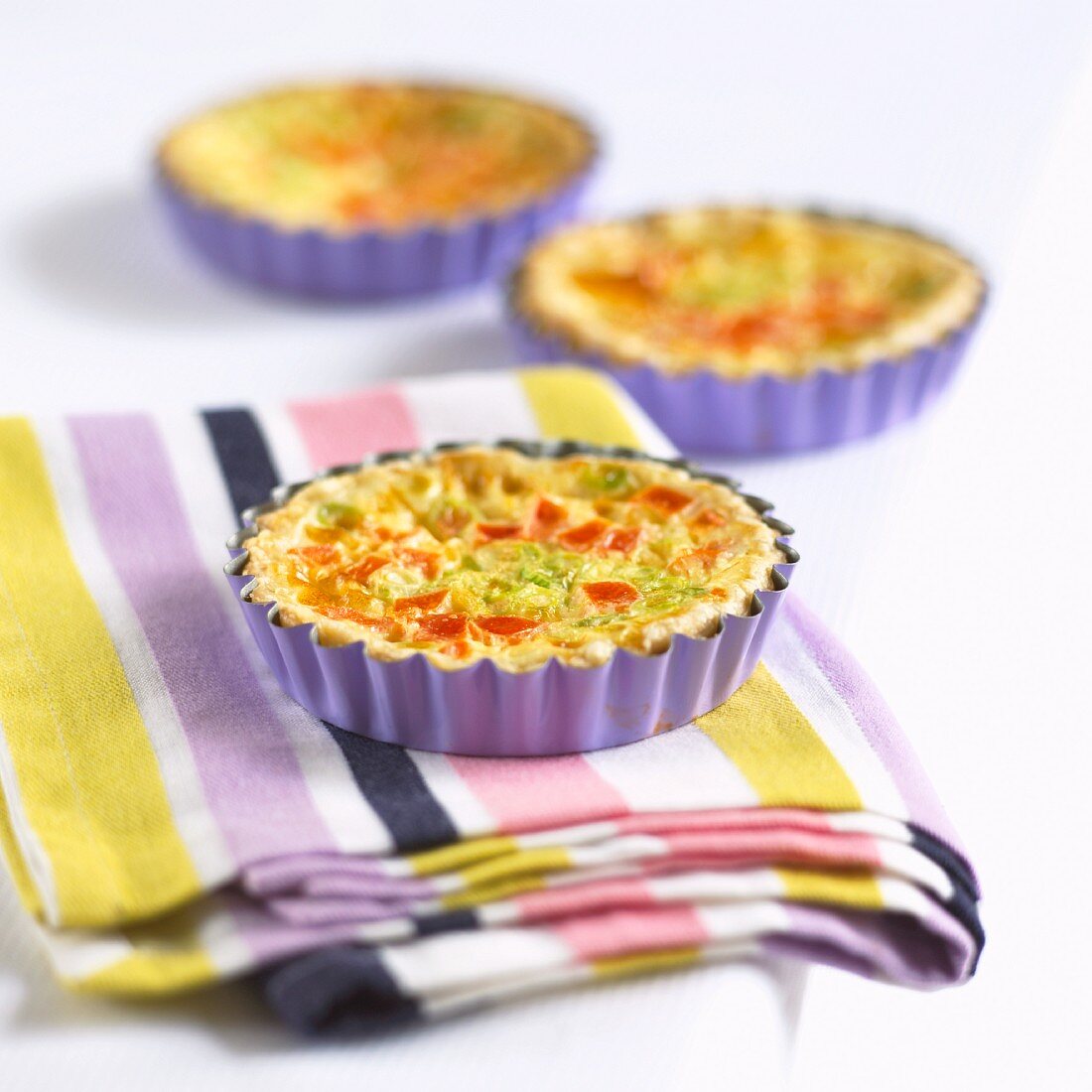 Three mini quiches with vegetables