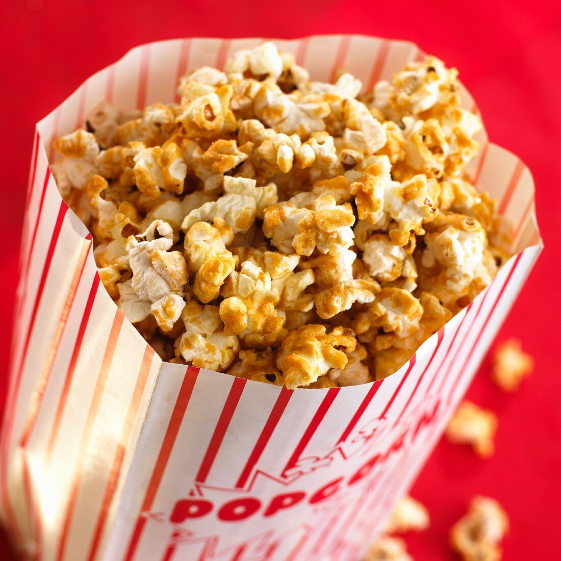 Toffee popcorn in a paper bag