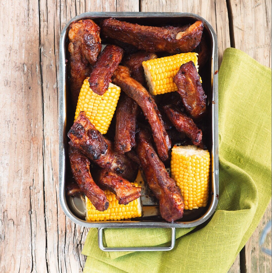Grilled ribs with corn cobs