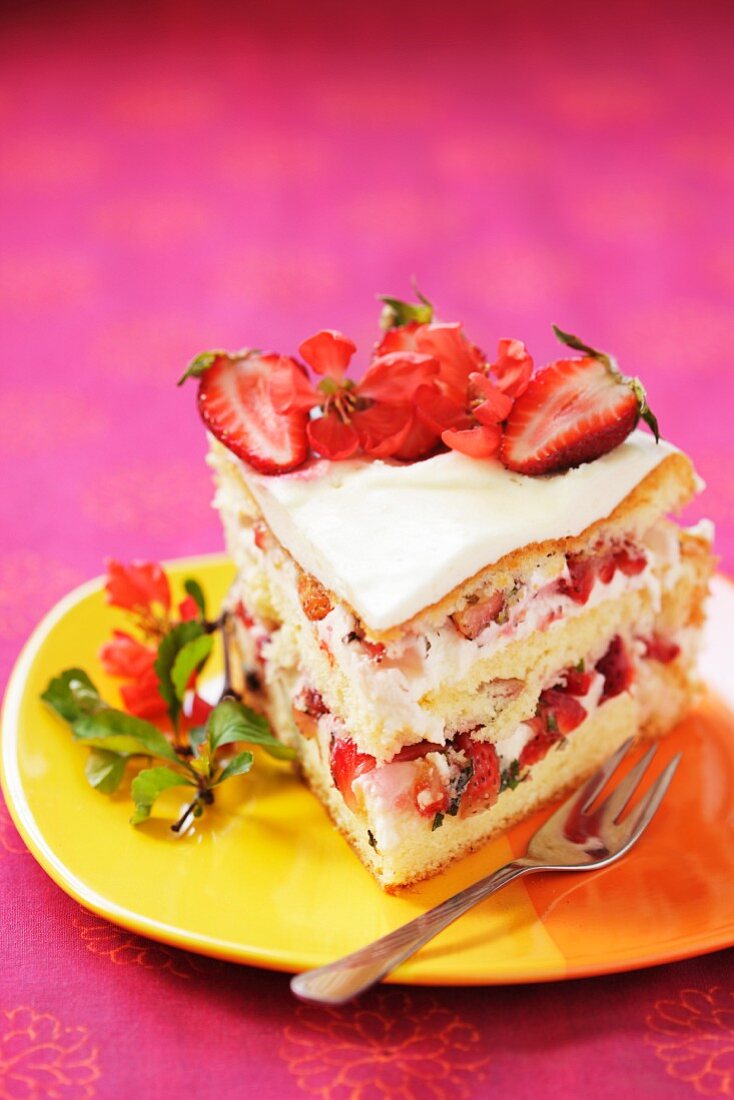 A slice of layered strawberry cake