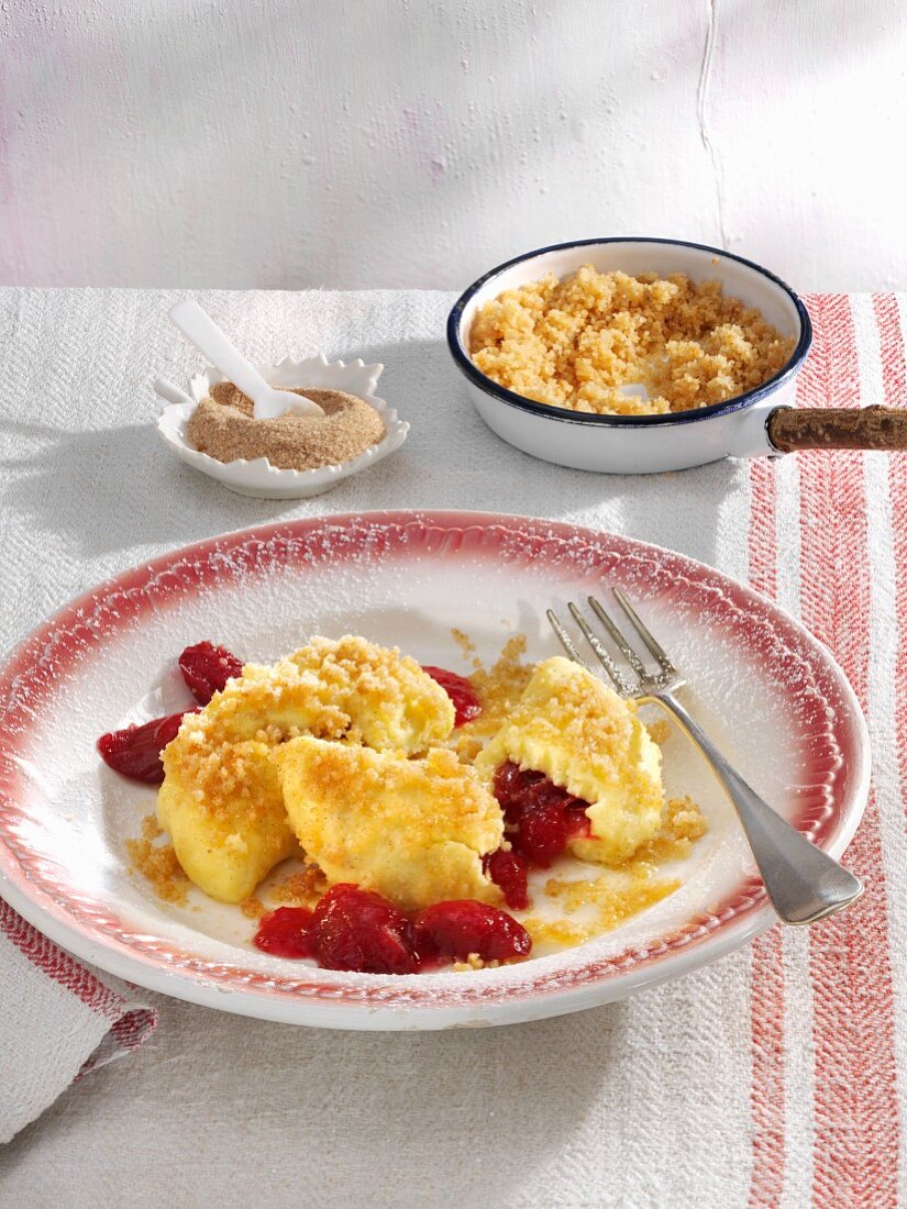 Quark ravioli filled with rhubarb and served with cinnamon crumbs