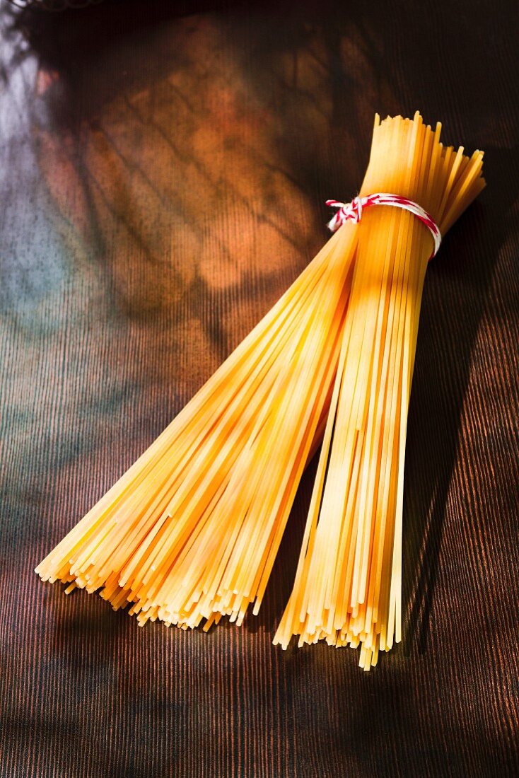 A bunch of spaghetti on a wooden surface