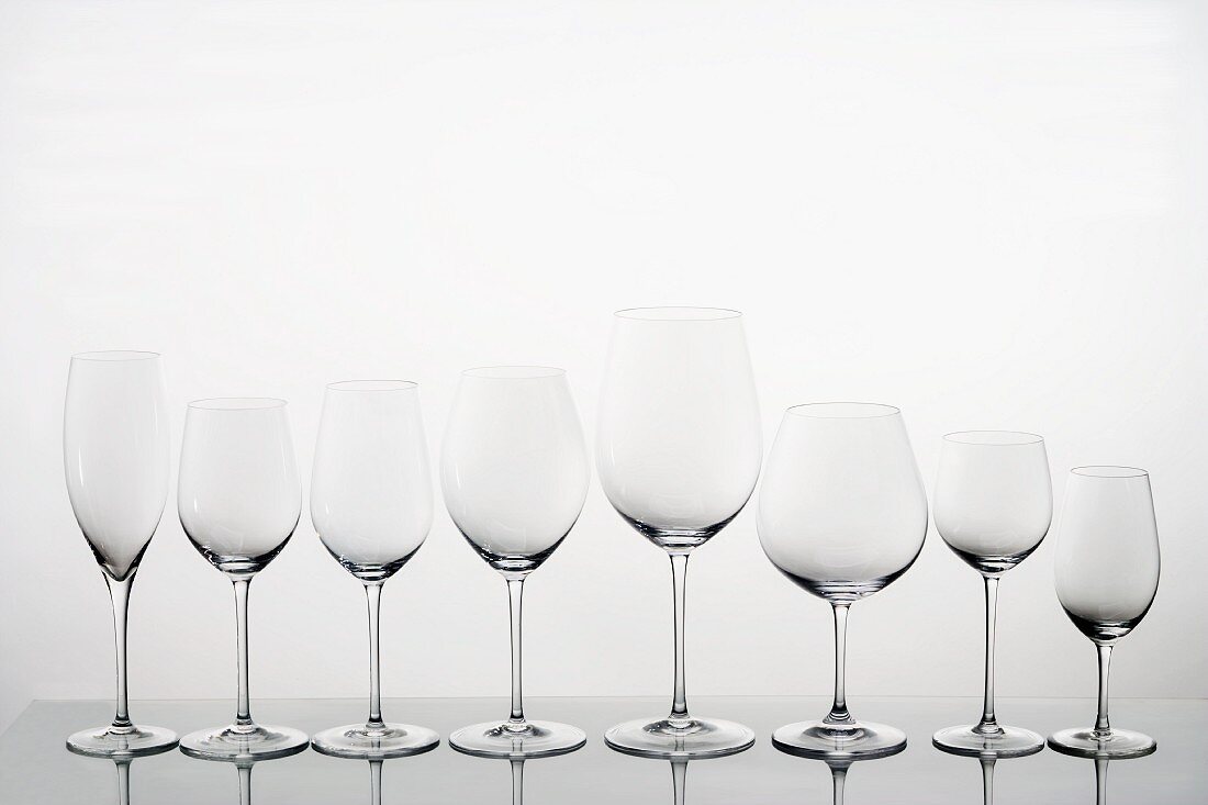 A row of empty wine glasses