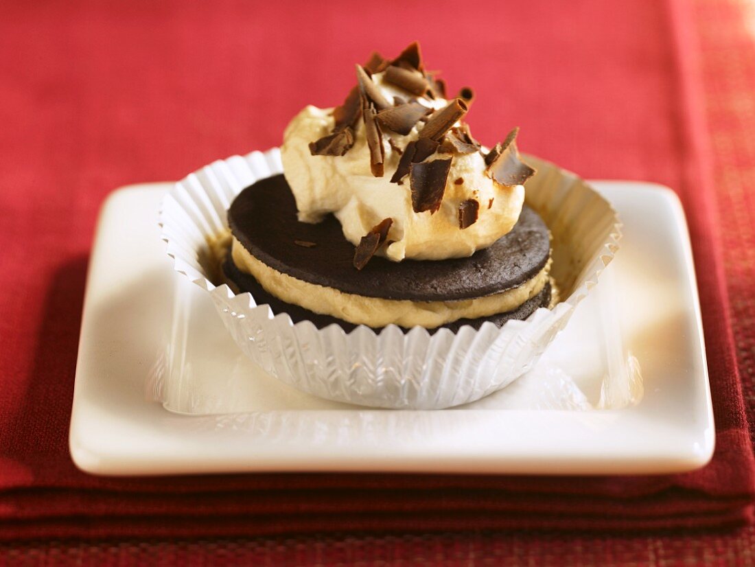 Cream Filled Chocolate Cookie with Chocolate Shavings; In a Foil Muffin Cup