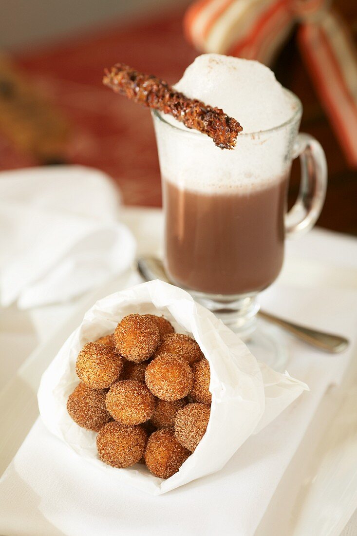 Paper Bag of Sugared Donut Holes; Cappuccino with Foam