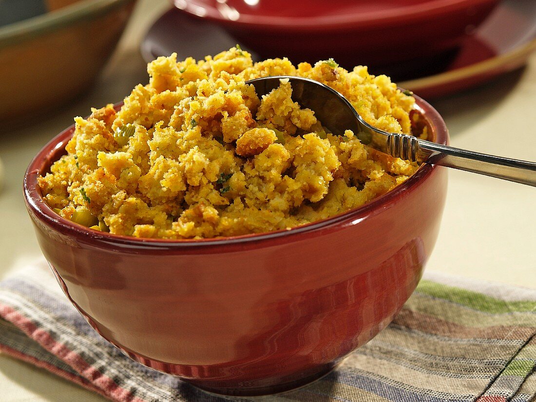 Bowl of Cornbread Stuffing with a Spoon