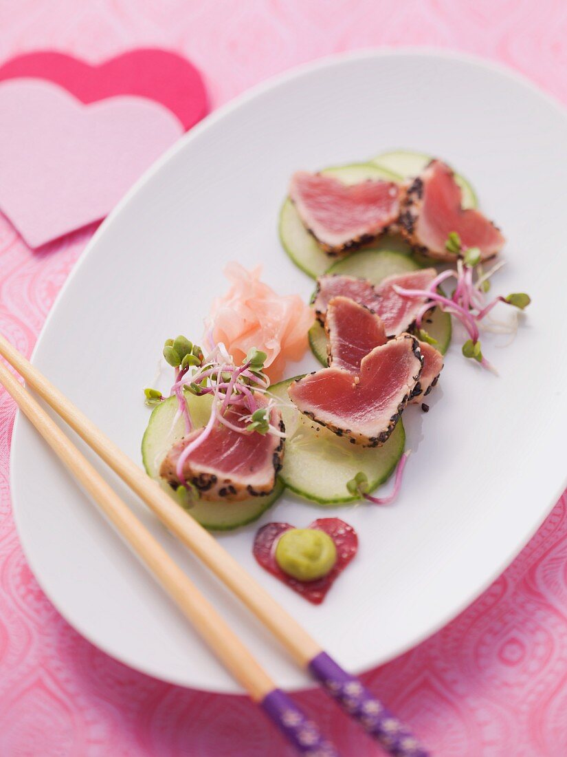 Flash-fried, heart-shaped tuna fillets on cucumber and marinated ginger