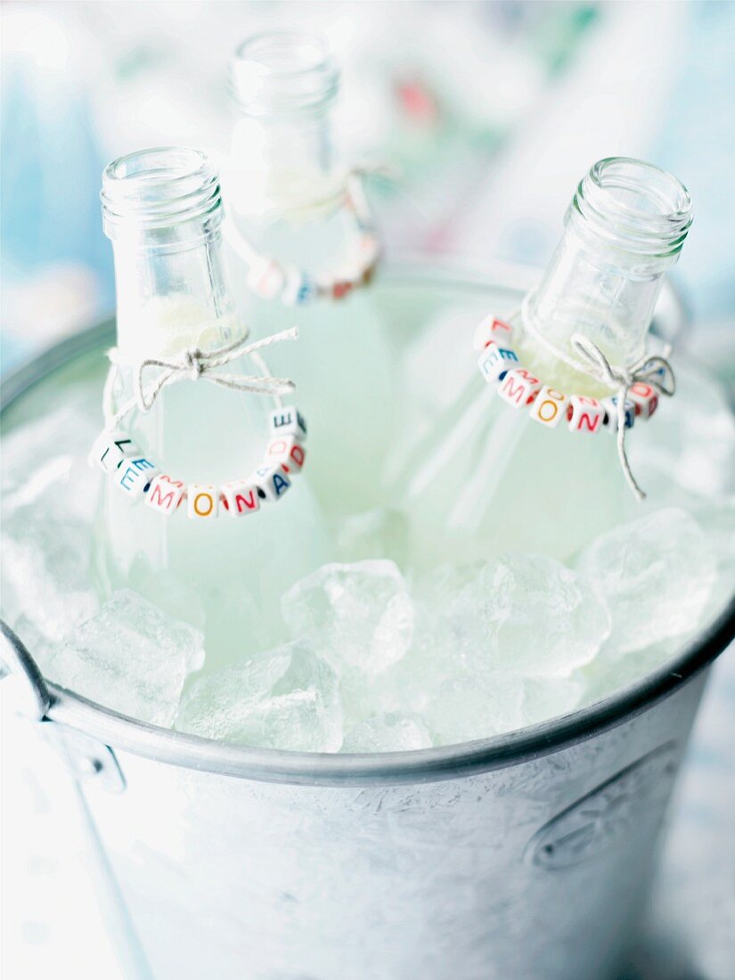 Lemonade bottles in an ice bucket