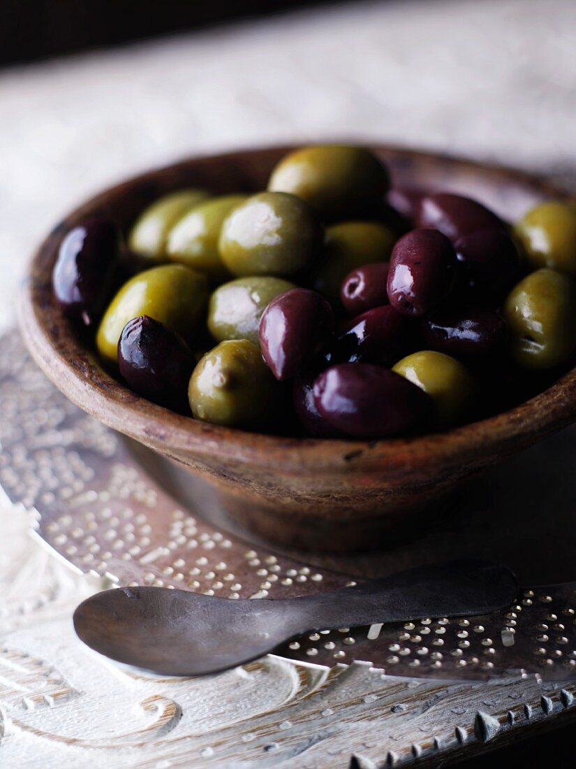 A bowl of black and green olives