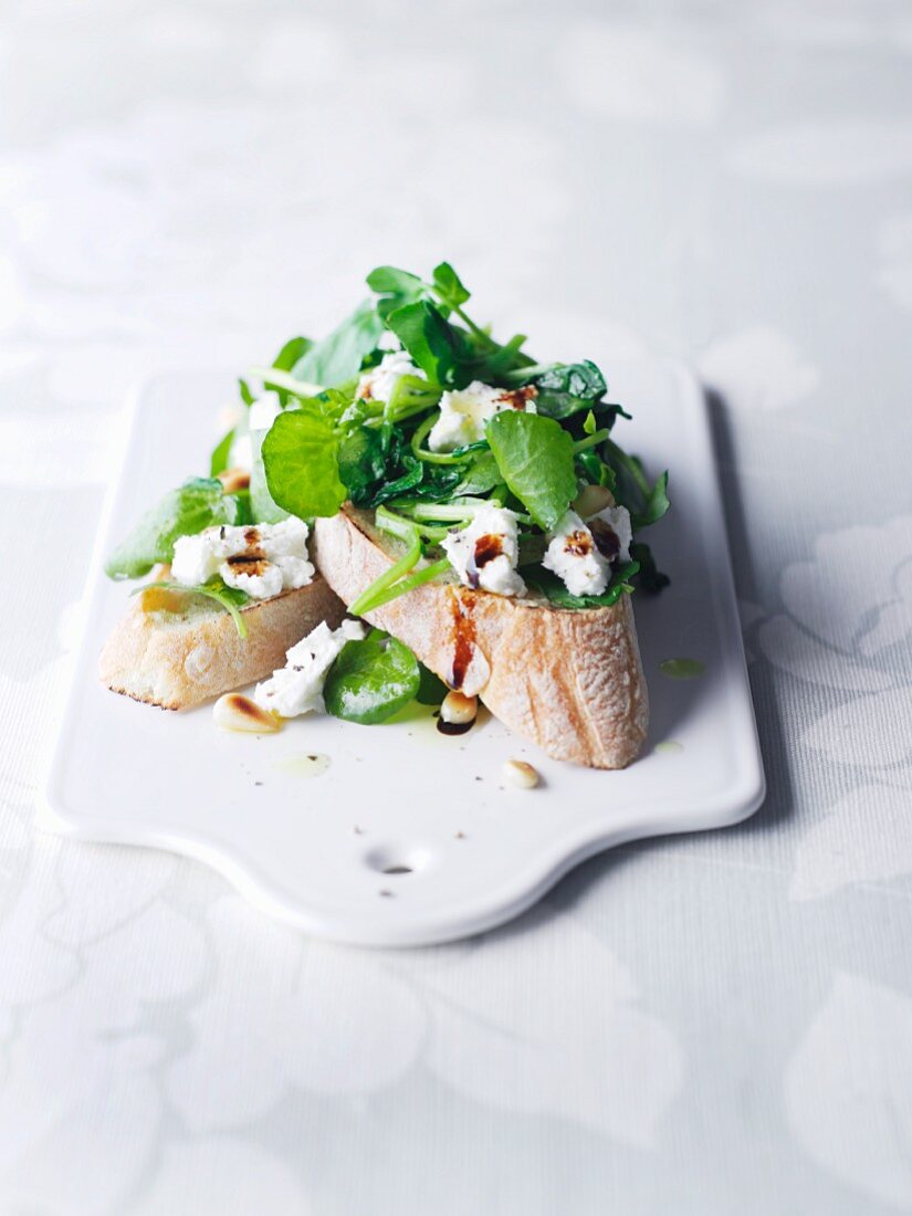 A slice of bread topped with watercress