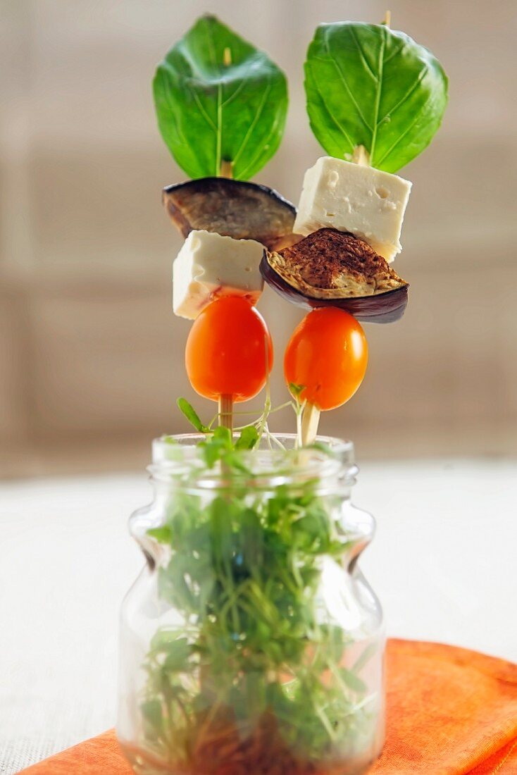 Aubergine and feta kebabs with basil and cress