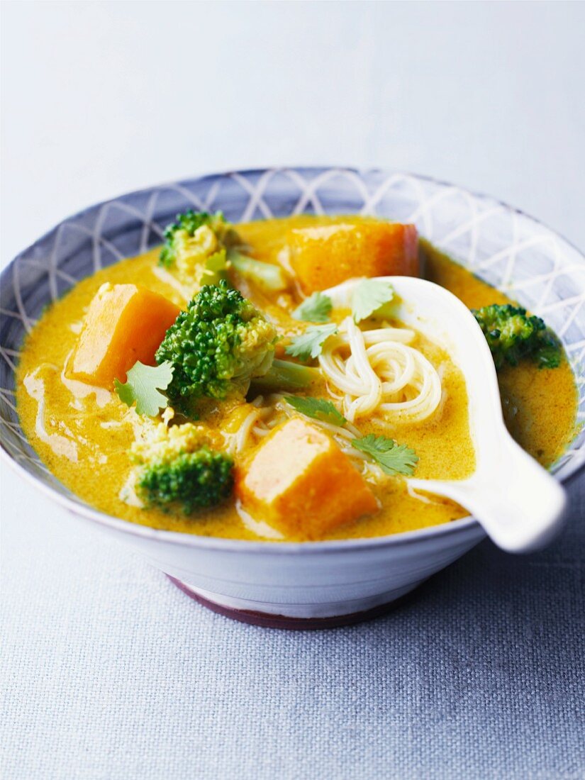 Curry and coconut soup with vegetables