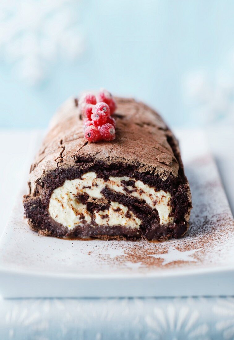 Chocolate Swiss roll filled with cream
