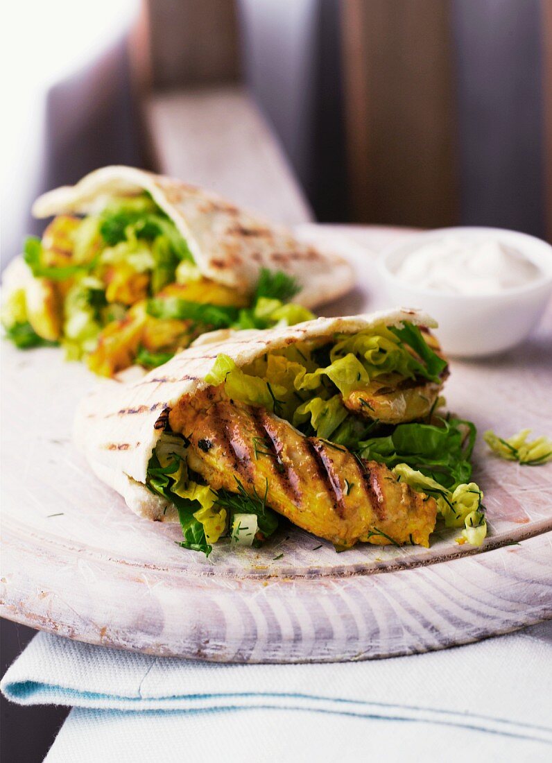 Pita filled with grilled chicken and salad