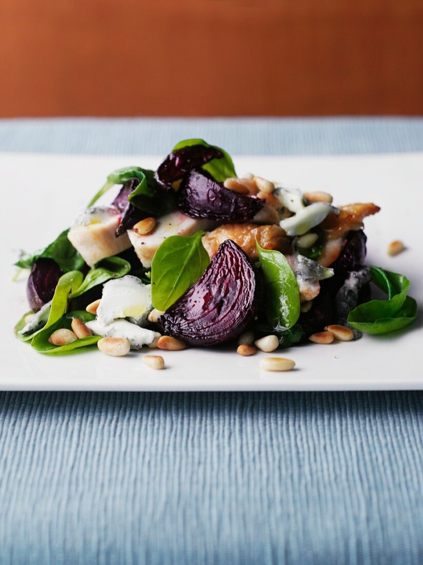 Chicken salad with beetroot, baby spinach and pine nuts