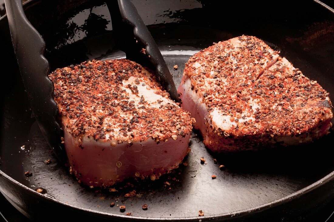 Tuna with a spicy coating being fried
