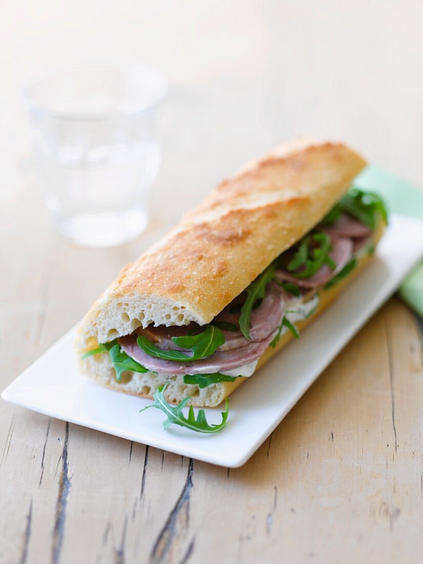 Baguette sandwich with lamb and rocket