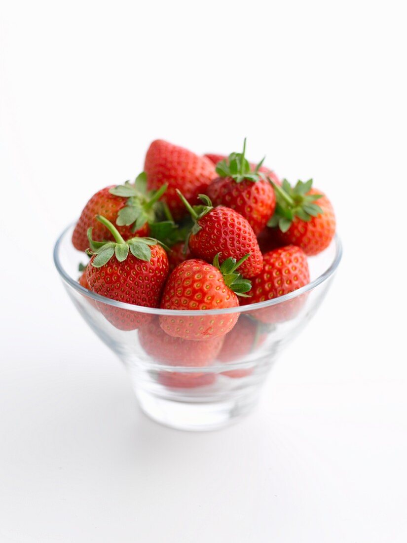 Fresh strawberries in a glass bowl