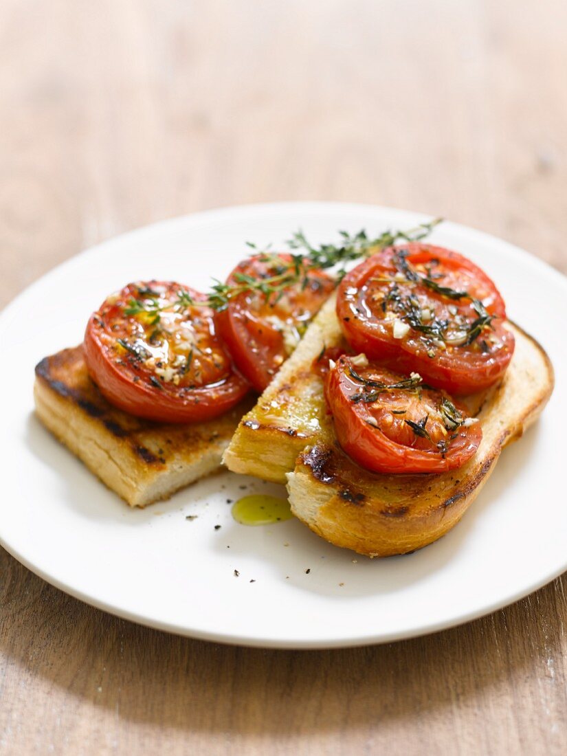 Toast topped with tomatoes and thyme
