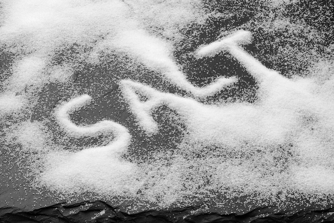 The word SALT written in salt