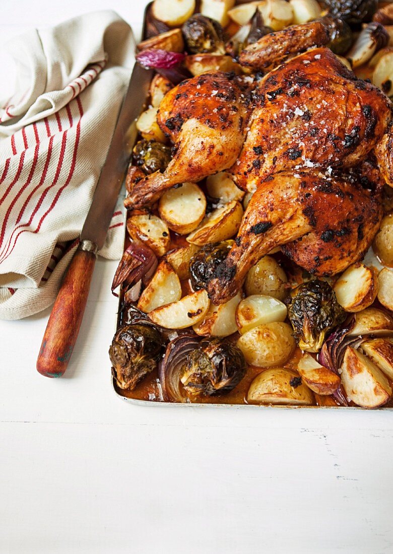 Oven-roasted pepper chicken with potatoes and onions