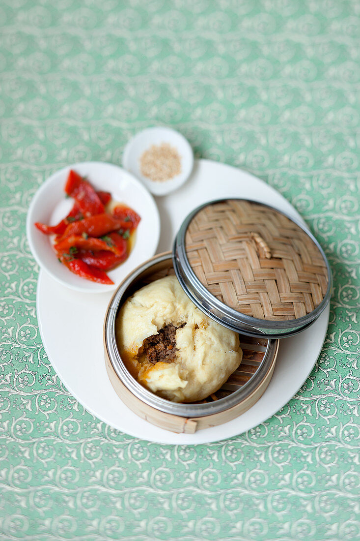 Chinese yeast dumplings filled with minced meat in a steamer basket