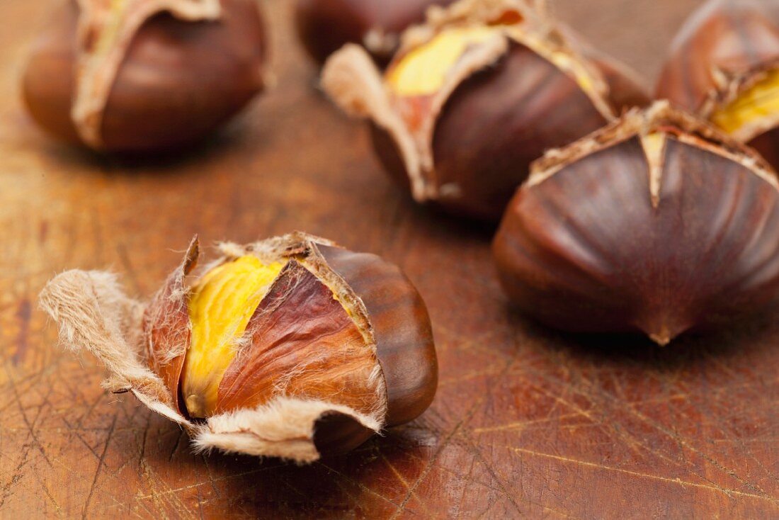 Roasted chestnuts on a wooden board