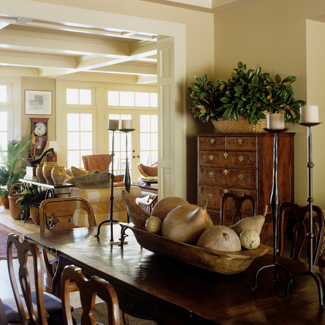 Dining area in front of large open doorway in traditional country house living-dining room