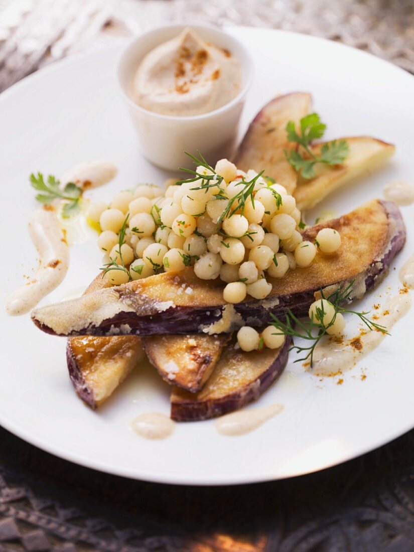 Fried aubergine slices with Lebanese couscous and harissa yogurt