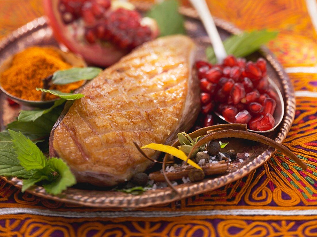 Fried duck breast with pomegranate seeds