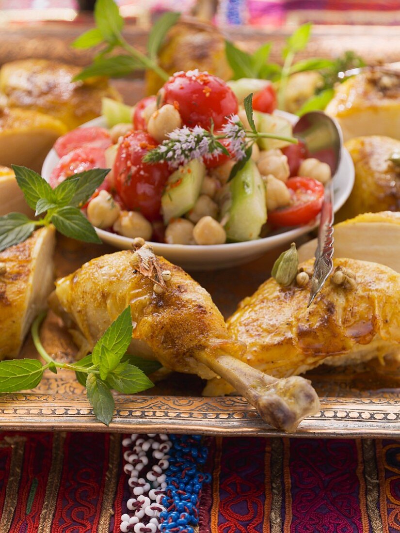 Fried chicken and chickpeas salad with cucumber and tomatoes