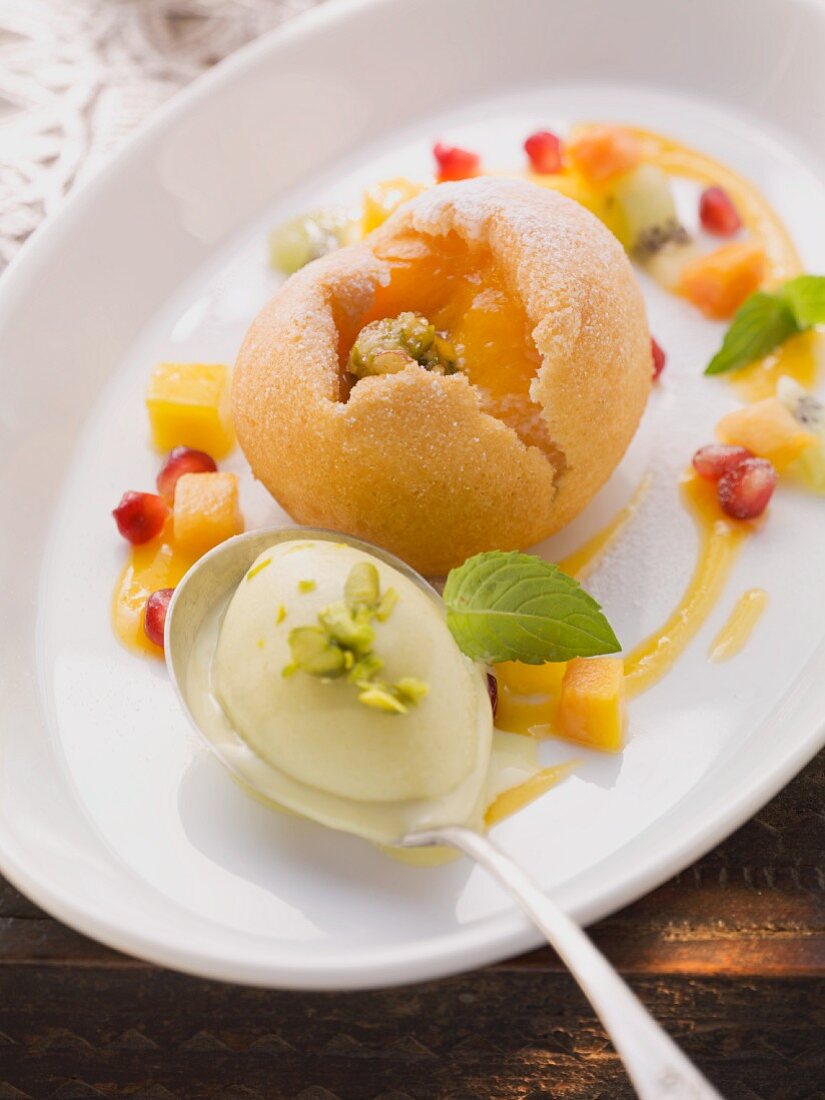 Baked medlars with fruit salad and pistachio ice cream