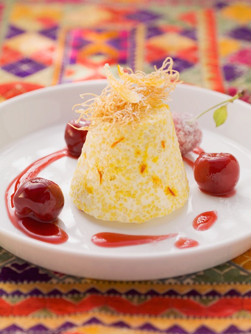 Couscous and saffron cream with cherries