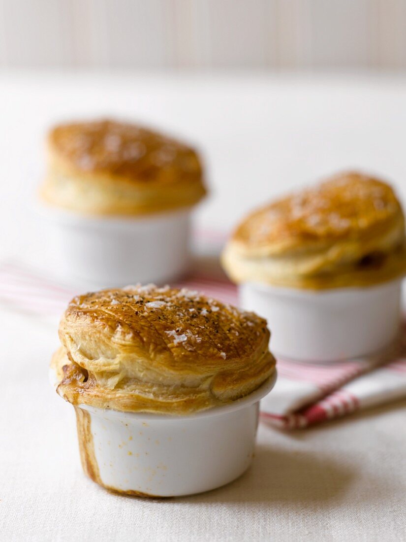 Pies with puff pastry lids