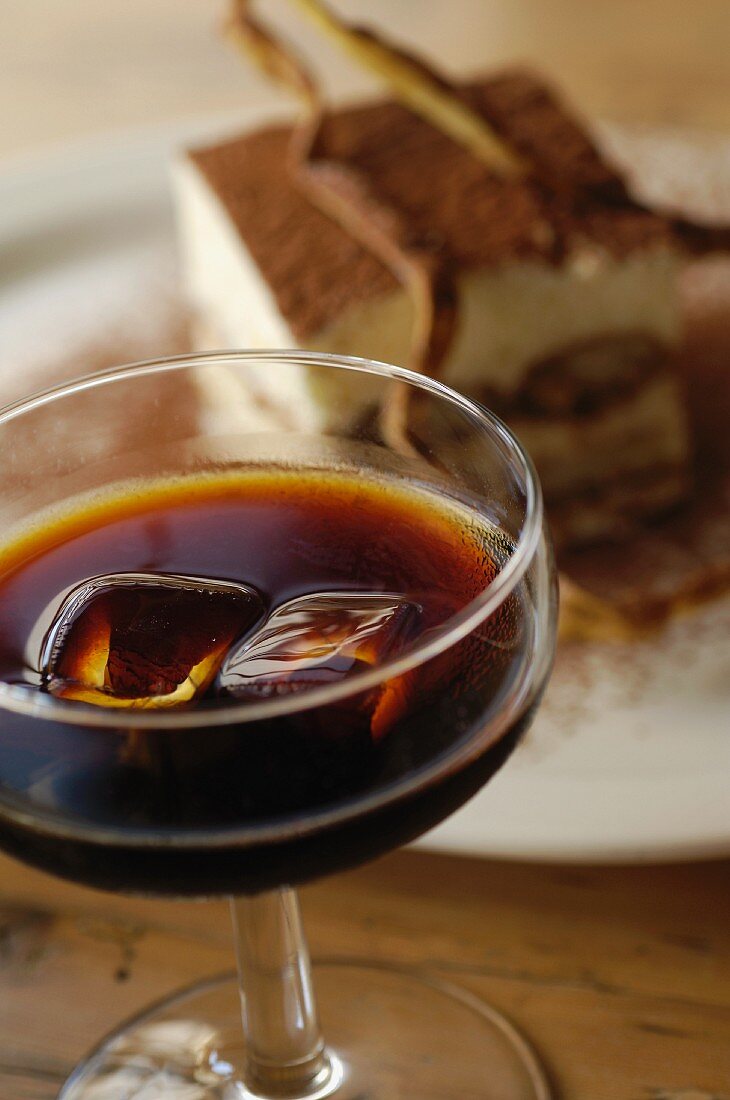 A glass of Tia Maria (coffee liqueur) and tiramisu