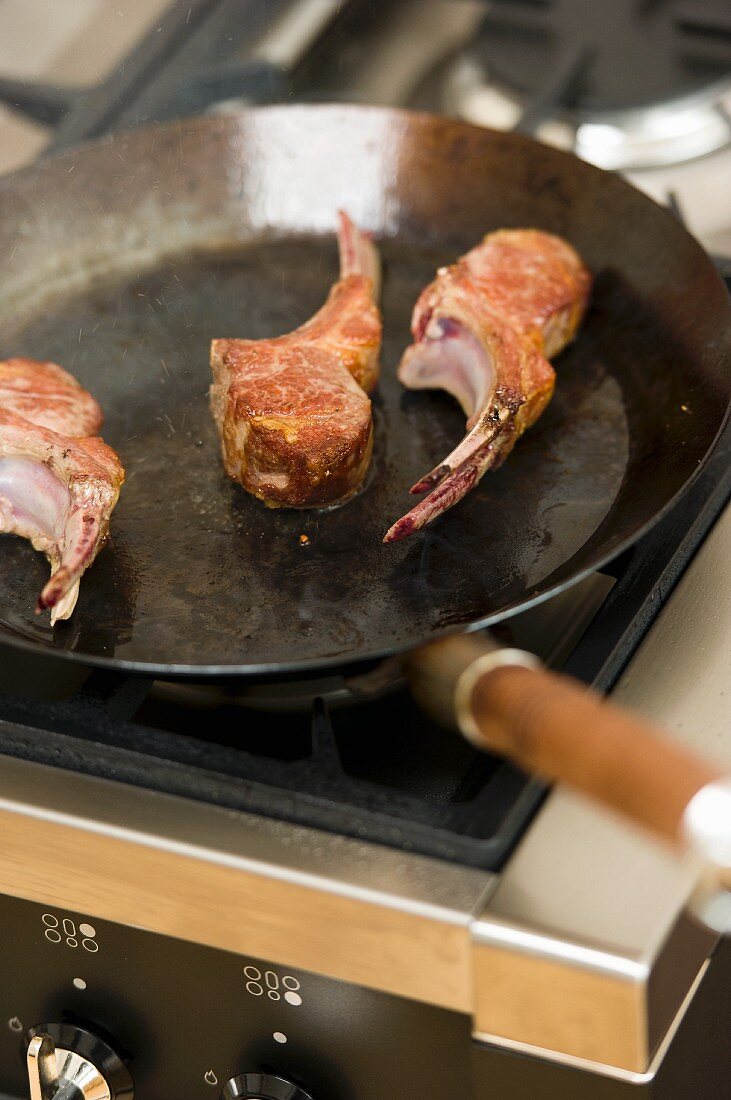 Fried lamb chops in a pan