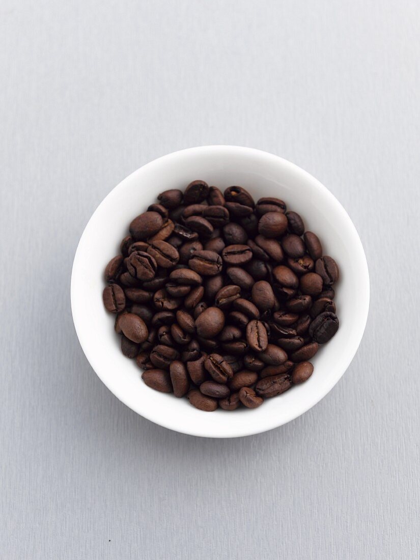 A bowl of coffee beans, seen from above