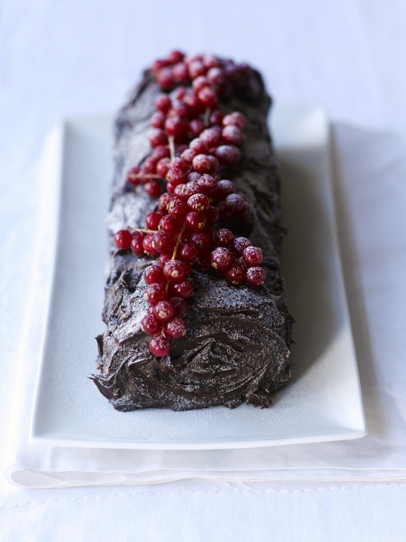 Yule log topped with redcurrants