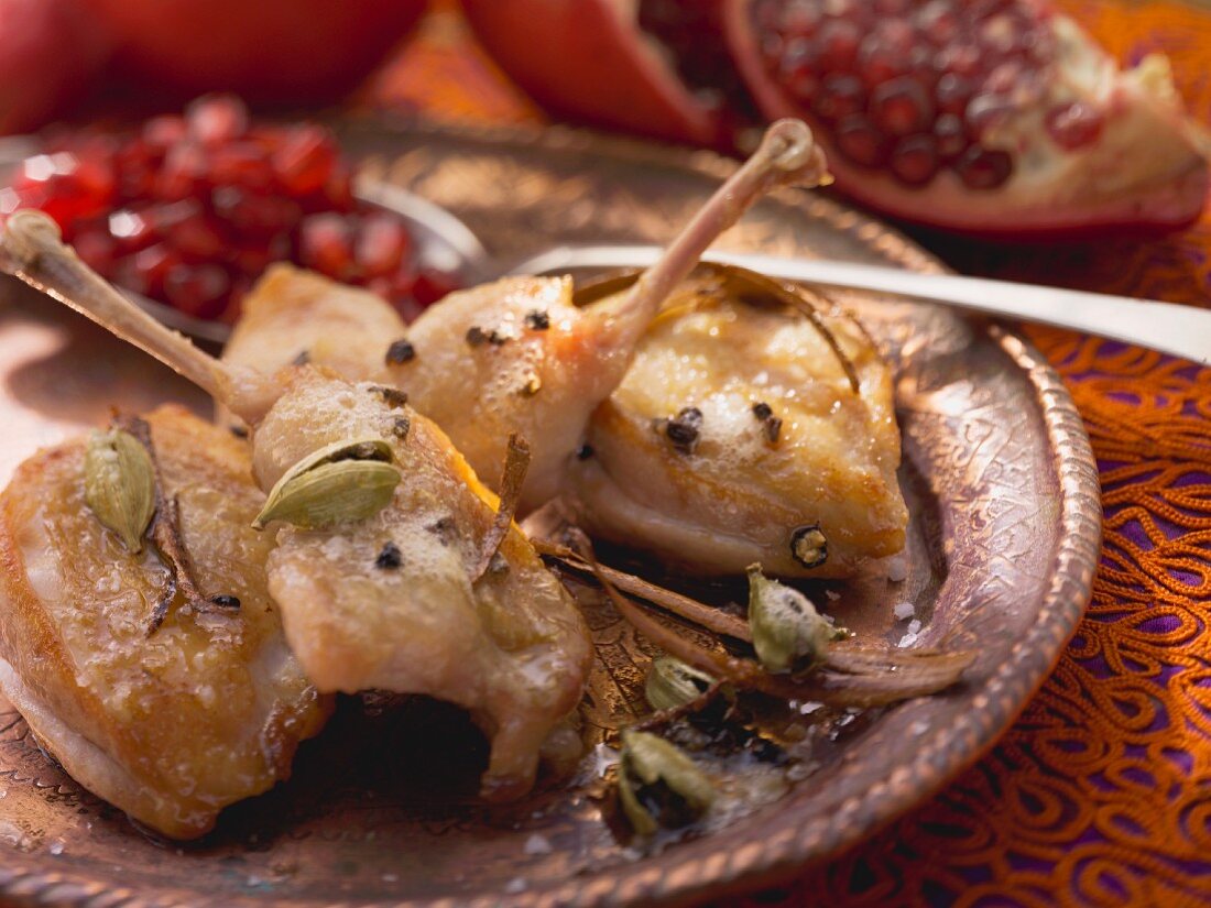Roasted quail with pomegranate seeds