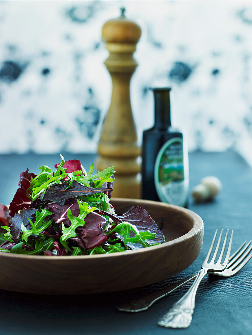 Mixed leaf salad in a wooden bowl