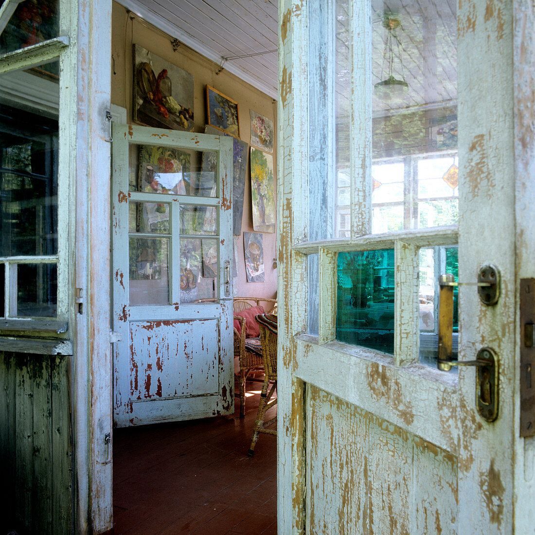 Peeling paint on old doors of simple wooden house