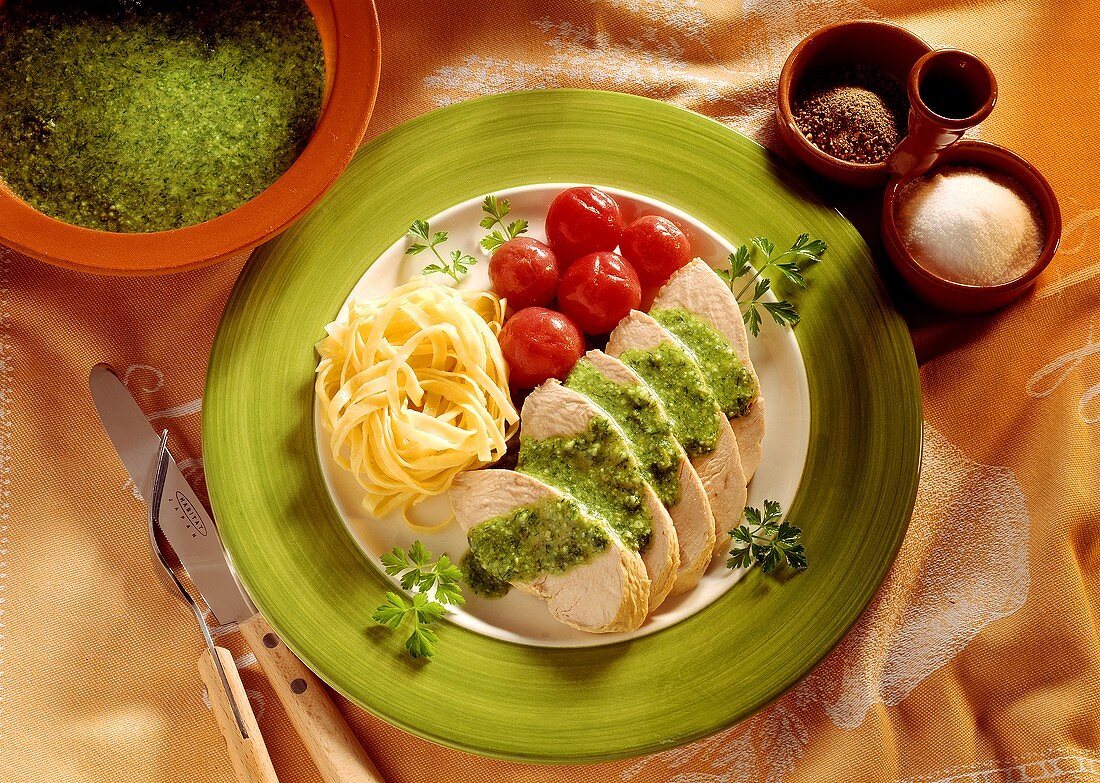 Poached turkey breast in slices with parsley pesto