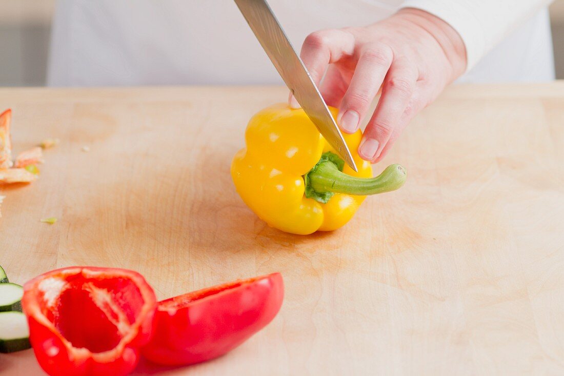 A pepper being halved