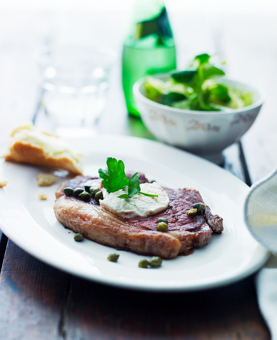 Beef steak with capers