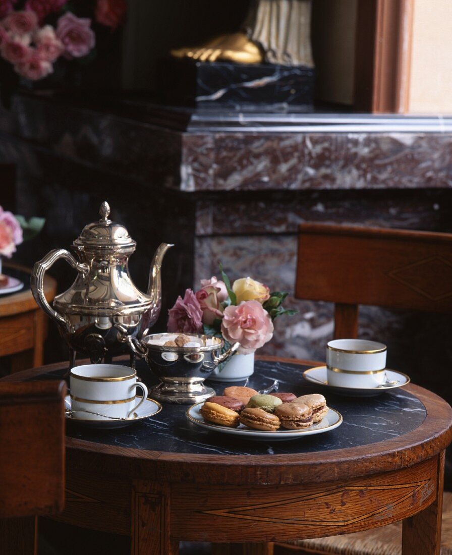 A table laid with macaroons and tea
