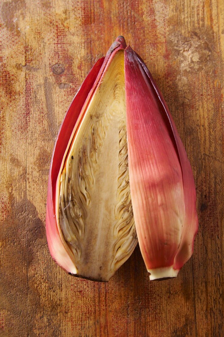 A banana flower, sliced open