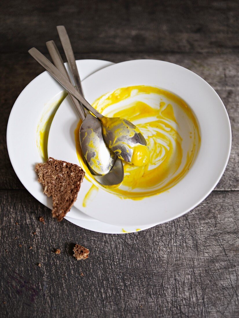 The remains of pumpkin soup in a bowl