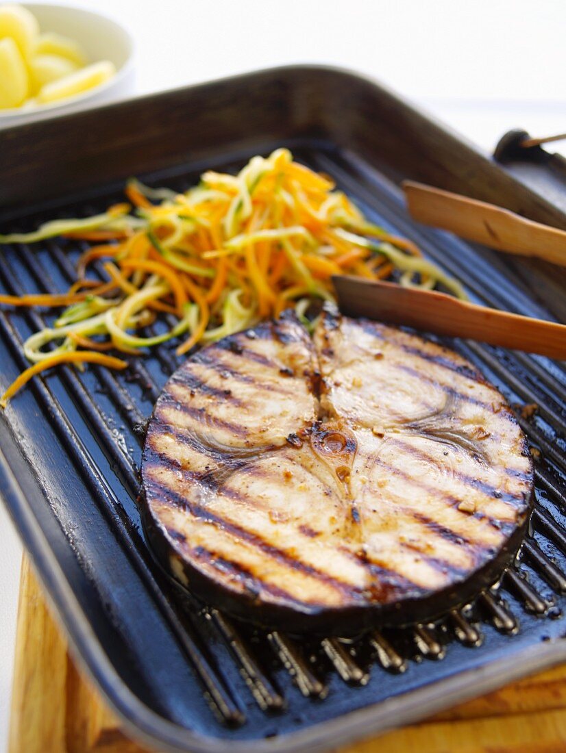 Grilled sword fish steak with julienned vegetables